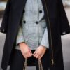 Black female coat with a patent leather details
