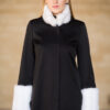 The Madeleine coat with the white faux fur sleeves and collar